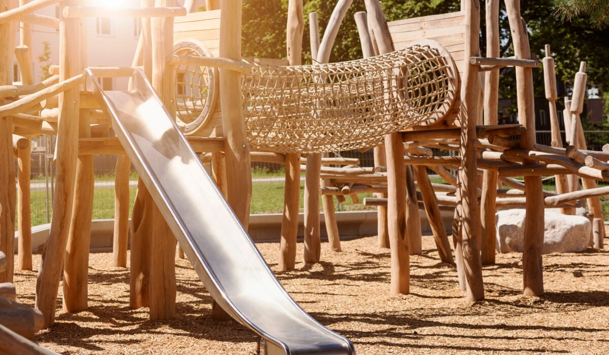 Children,Playground,On,Public,Yard,In,Park,With,Swings,,Slides